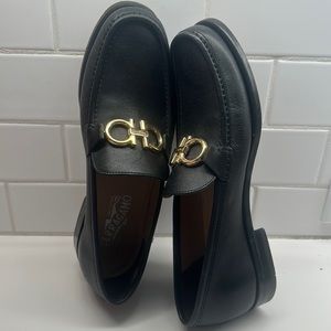 Black gold buckle Ferragamo dress shoes